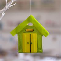 handmade colourful glass beach hut by molten wonky