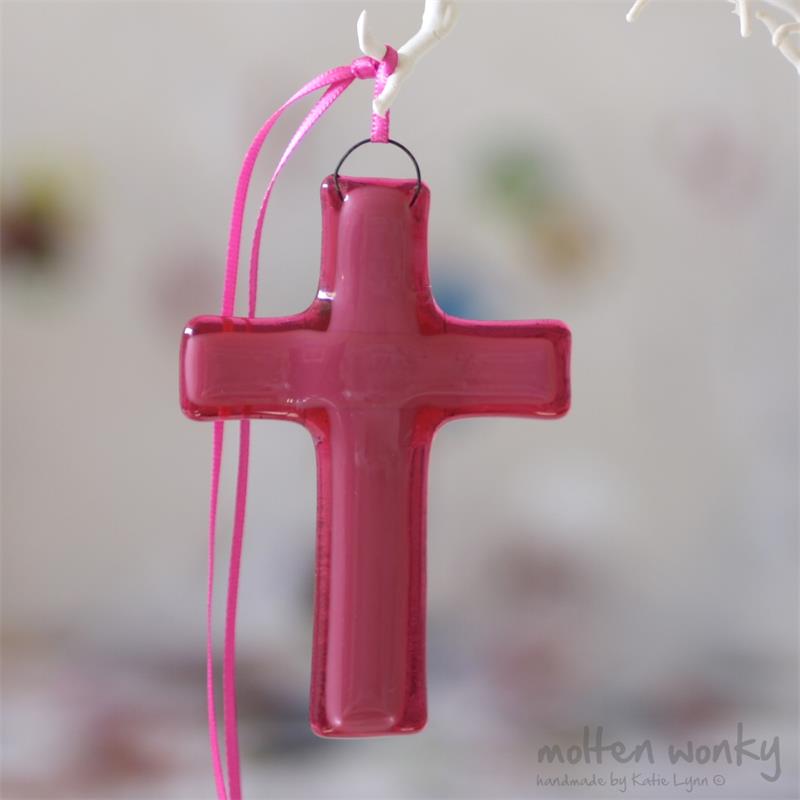 fused glass cross with an aura of colour from molten wonky