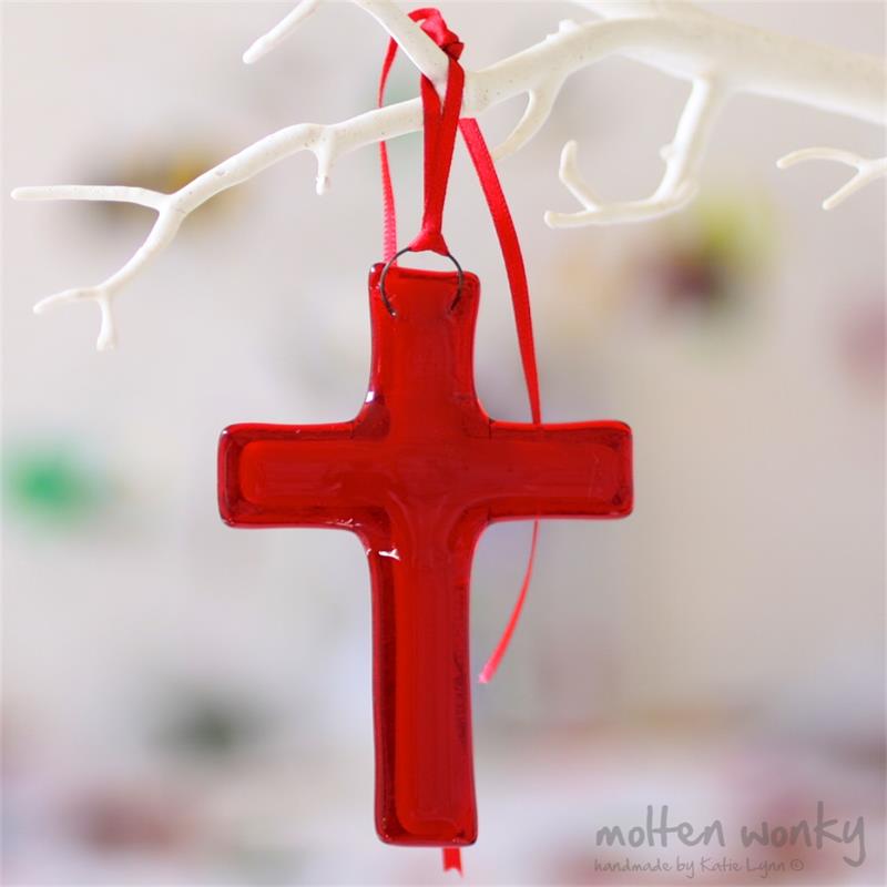 fused glass cross with an aura of colour from molten wonky