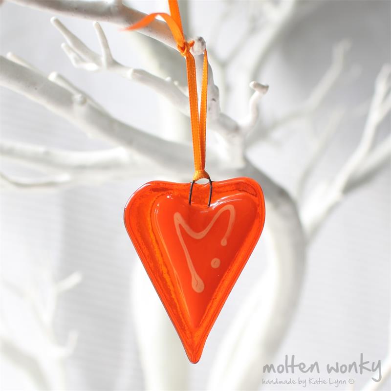 little orange fused glass love heart hanging decoration made by molten wonky